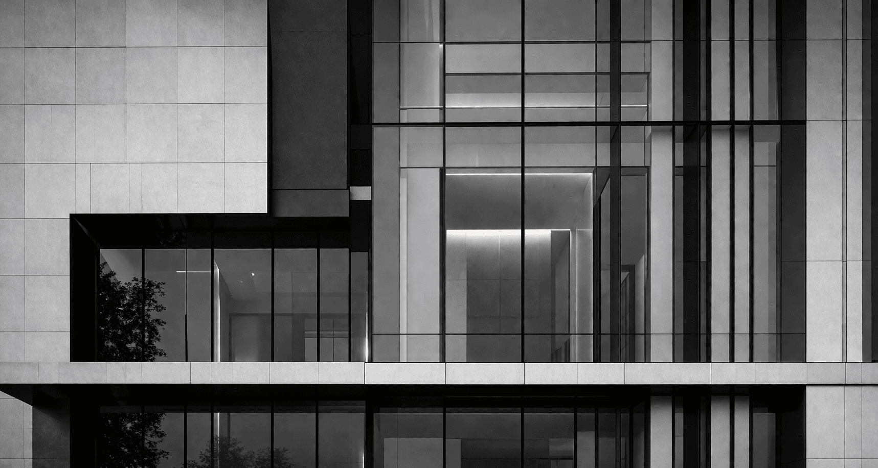 Monochrome building facade with strict grid lines and glass surfaces.
